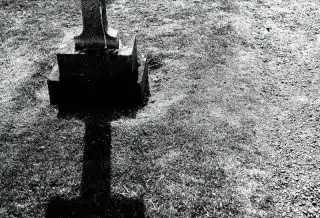 grayscale photography of gray tombstone