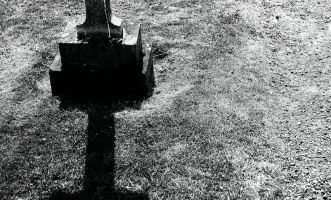 grayscale photography of gray tombstone